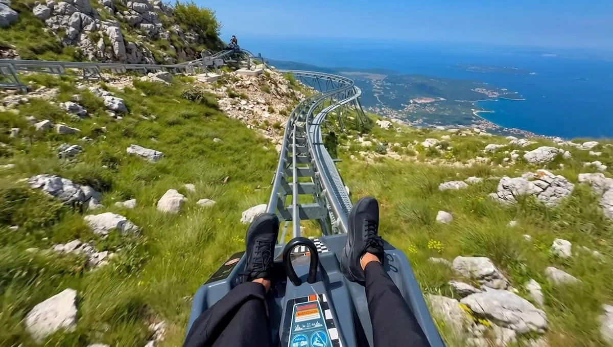 A ride down the mountain in a small individual carriage with Kotor Alpine Coaster